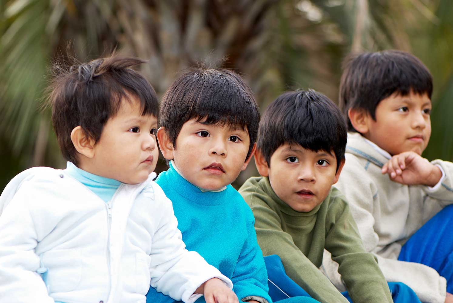 Four latino young boys