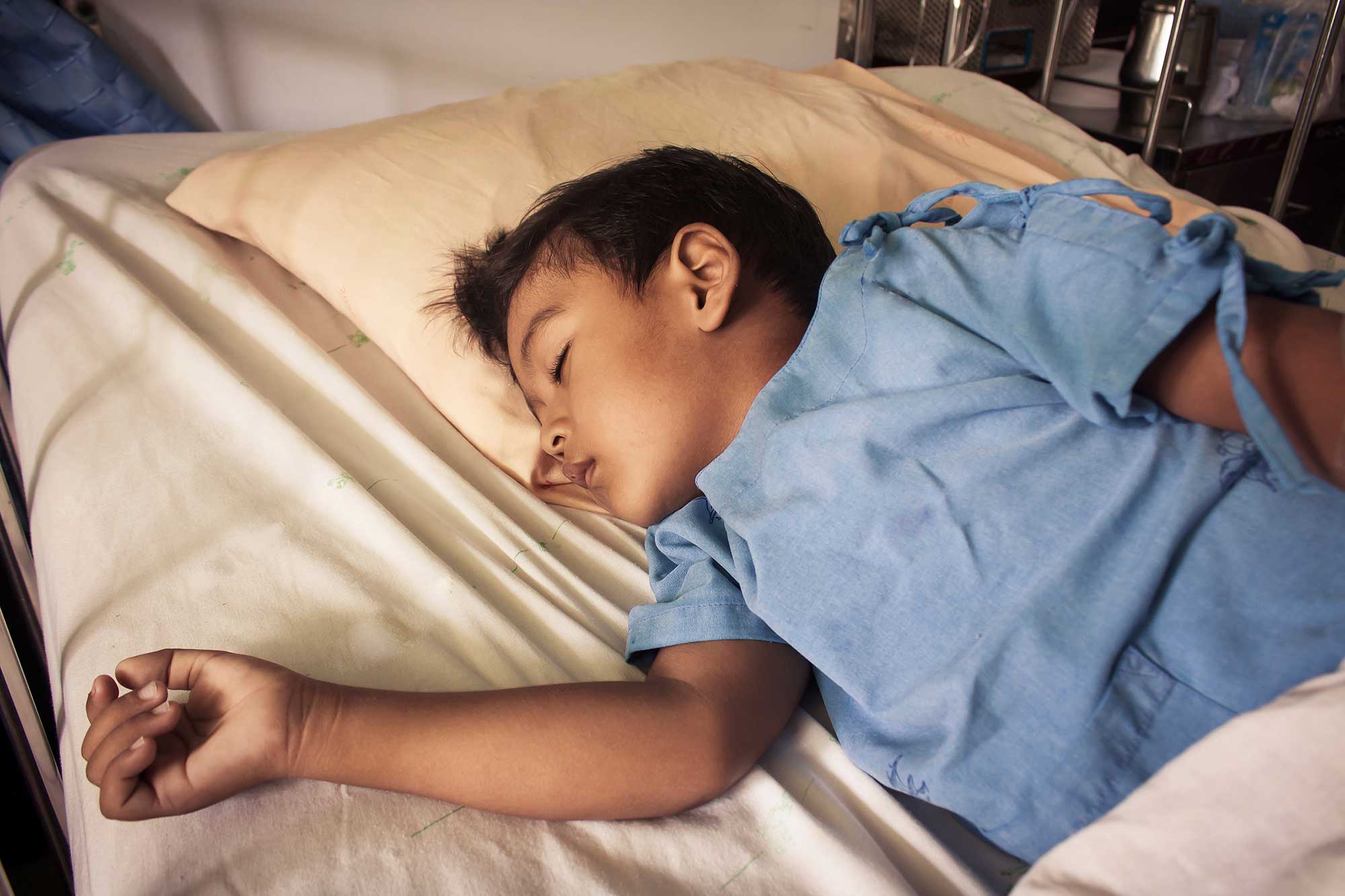 Boy in hospital bed