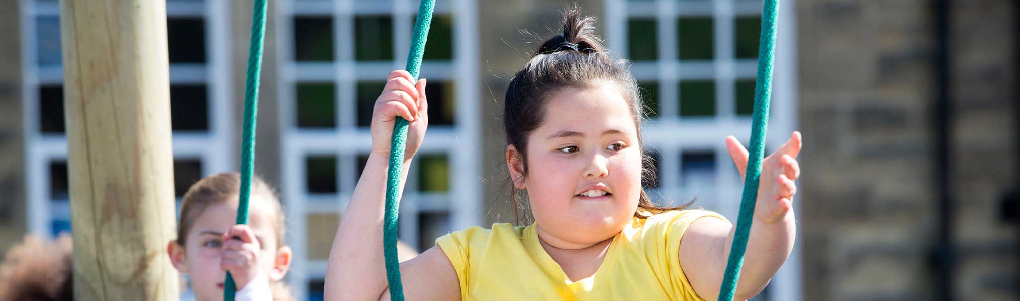 Overweight girl on playground