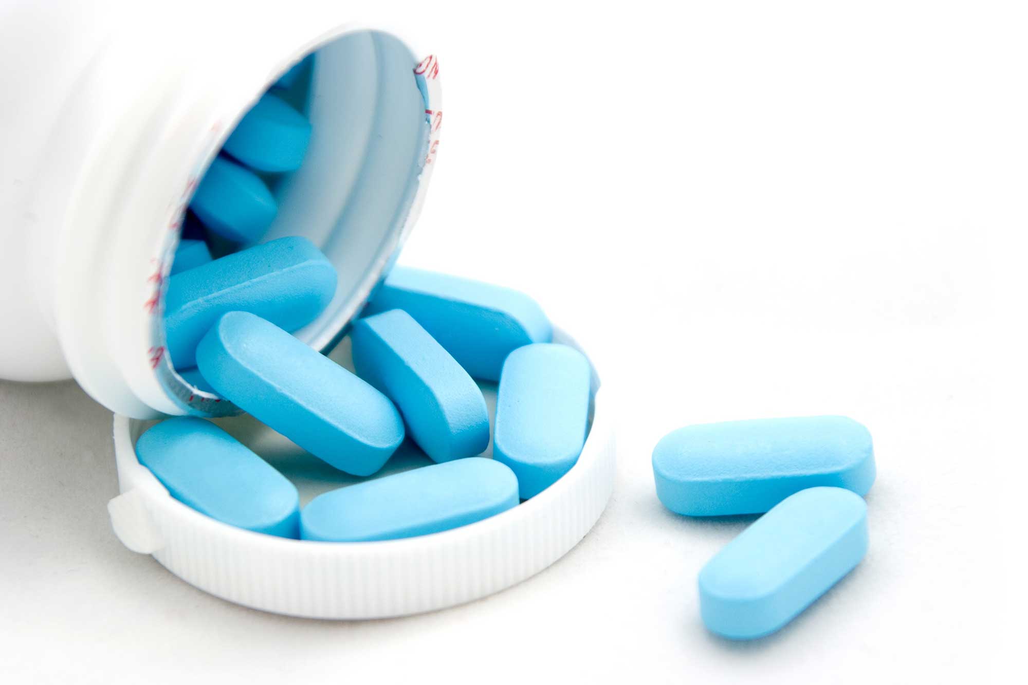 pill bottle with blue pills