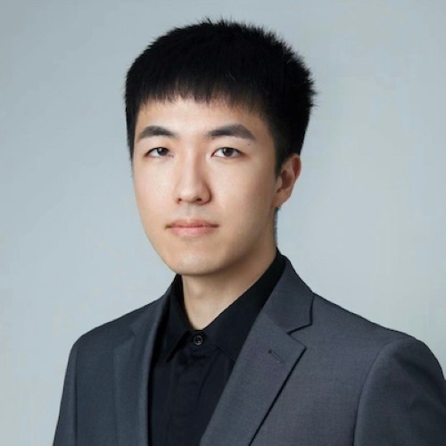 Scott Lu wearing a black shirt and gray blazer.