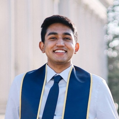 Photo of Sidharth Satya wearing blue collared shirt, blue tie, and blue sash