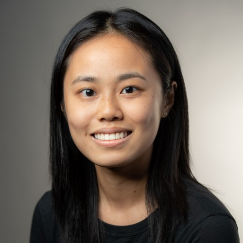 Lucy Li who has long dark hair and is wearing a black top