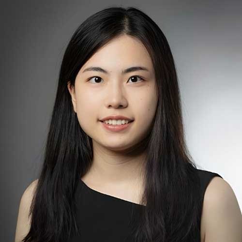 Jiayi Liu wearing black top against grey background